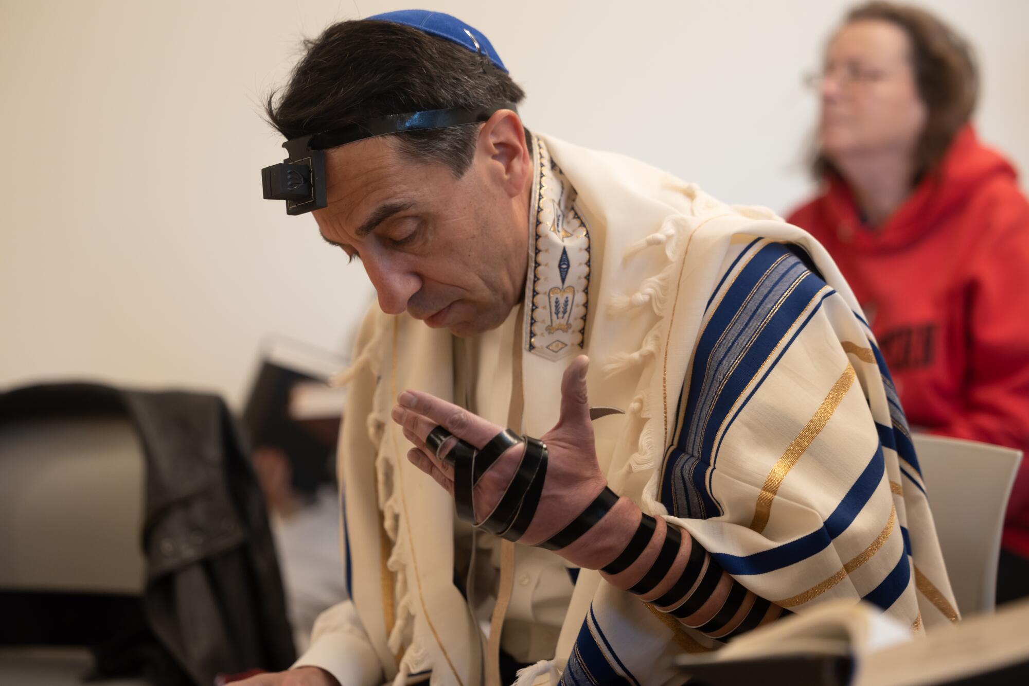 Santa Clara County Dist. Atty. Jeff Rosen reads at a Jewish prayer service.