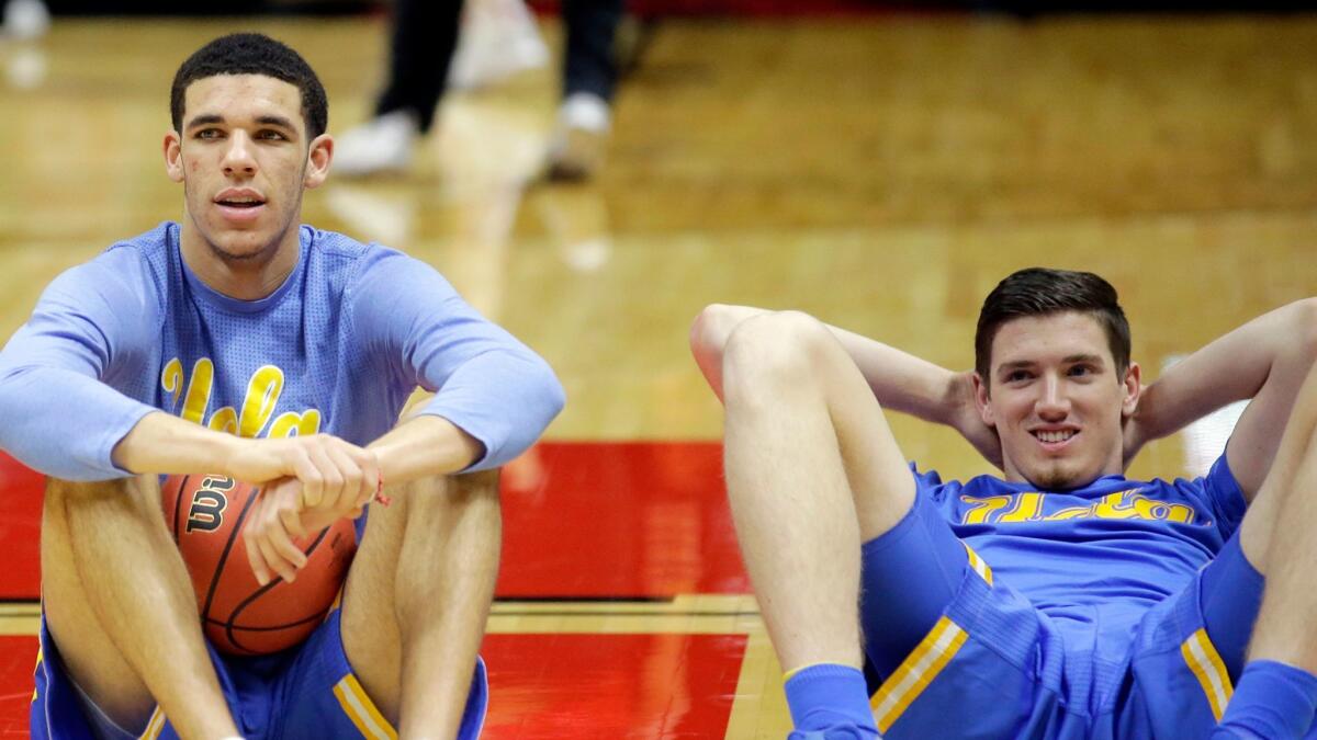 UCLA's Lonzo Ball, left, and TJ Leaf sit on the court during practice before the Bruins' game against Utah on Jan. 14.