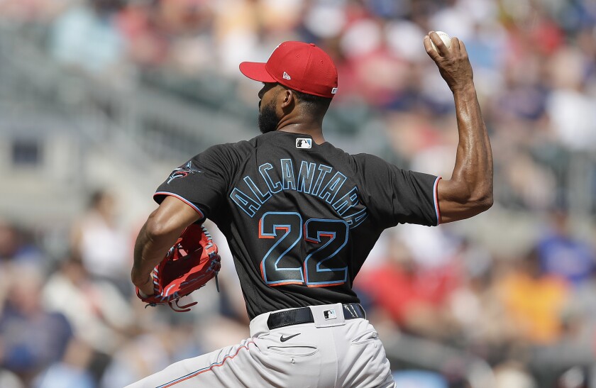 Miami Marlins pitcher Sandy Alcantara works against the Atlanta Braves in the first inning of a baseball game Saturday, July 3, 2021, in Atlanta. (AP Photo/Ben Margot)