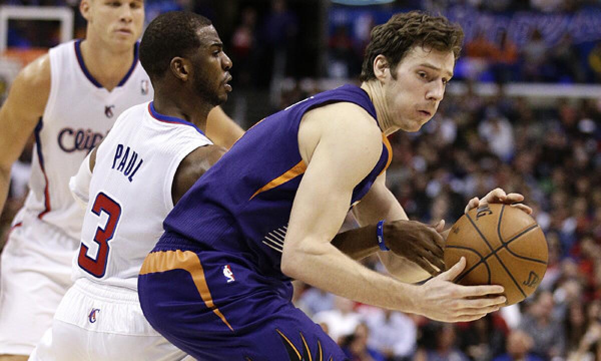 Clippers point guard Chris Paul, left, defends against Phoenix Suns guard Goran Dragic during the Clippers' 107-88 loss on Dec. 30. Keep Dragic in check will be one of the Clippers' defensive priorities when the teams meet again Tuesday.