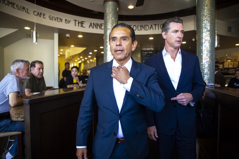 LOS ANGELES, CALIF. - JUNE 19: Former Los Angeles Mayor Antonio Villaraigosa and California Lt. Governor Gavin Newsom walk out to speak at a press conference in front of Homegirl Cafe on Tuesday, June 19, 2018 in Los Angeles, Calif. (Kent Nishimura / Los Angeles Times)