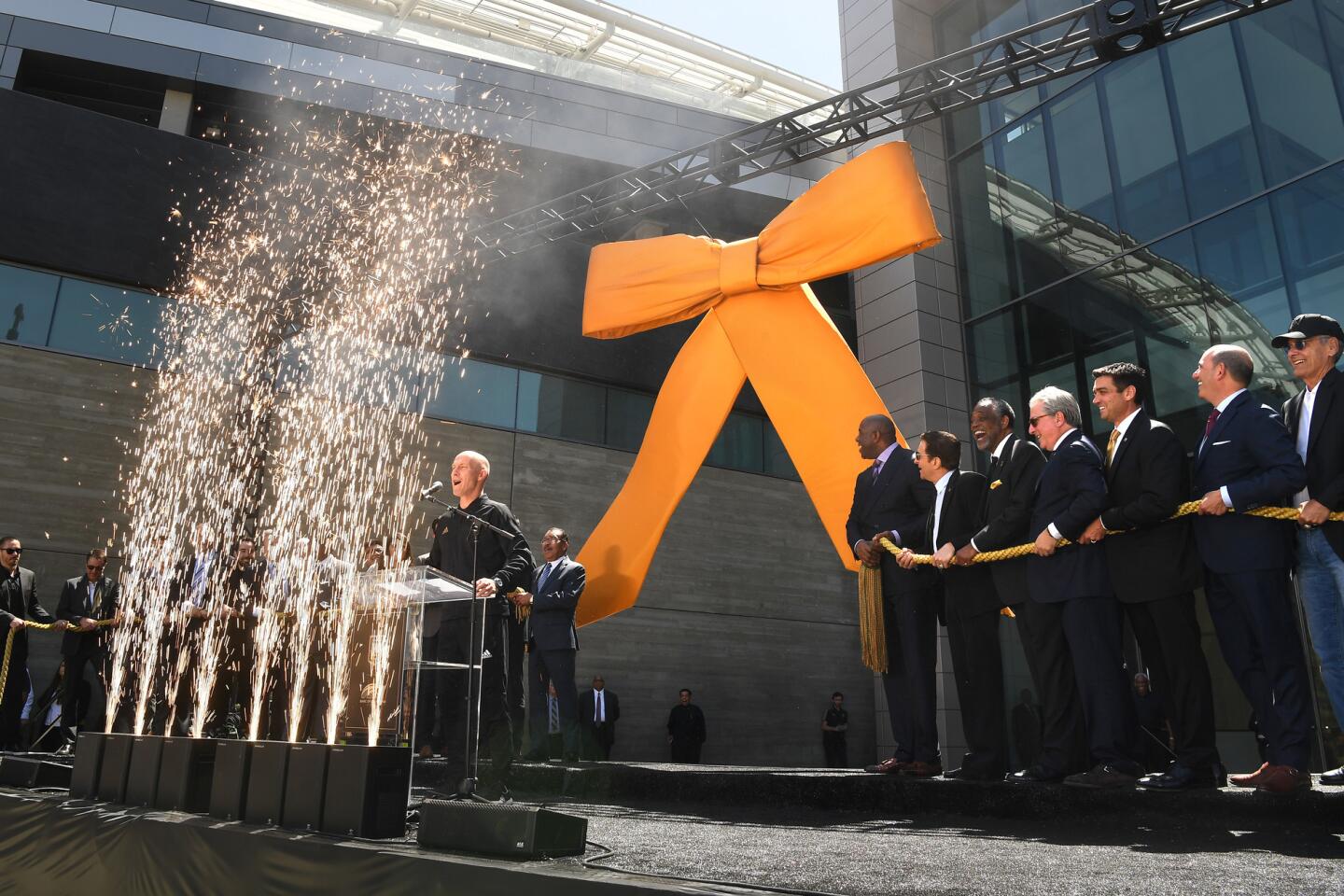 LAFC head coach Bob Bradley welcomes dignitaries outside the Banc of California Stadium for the ribbon cutting on April 18.
