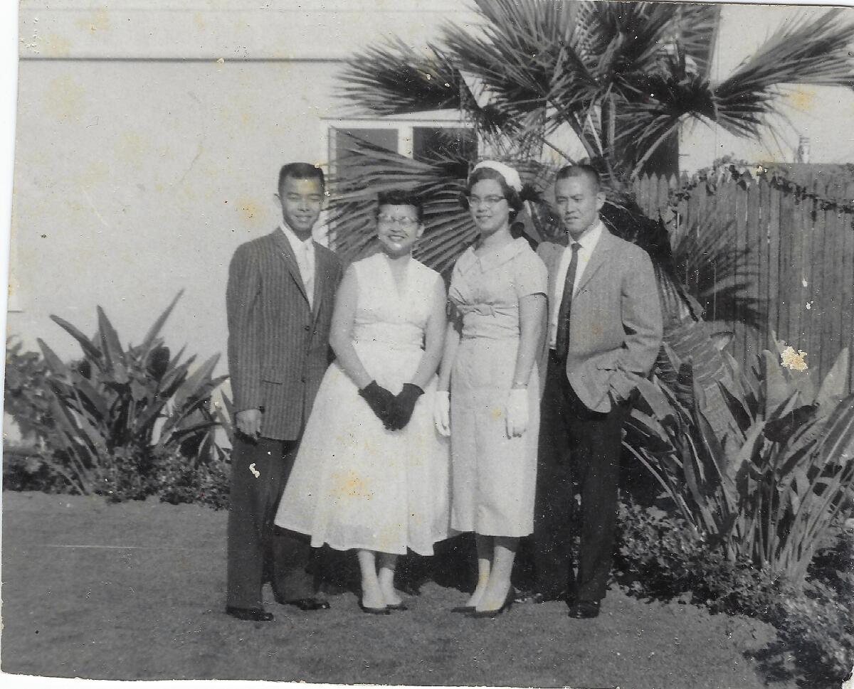 The Dong children stand in front of their Coronado home in 1959.