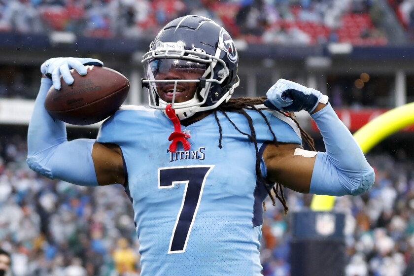 Tennessee Titans running back D'Onta Foreman celebrates after scoring a touchdown on a 21-yard run against the Miami Dolphins in the first half of an NFL football game Sunday, Jan. 2, 2022, in Nashville, Tenn. (AP Photo/Wade Payne)