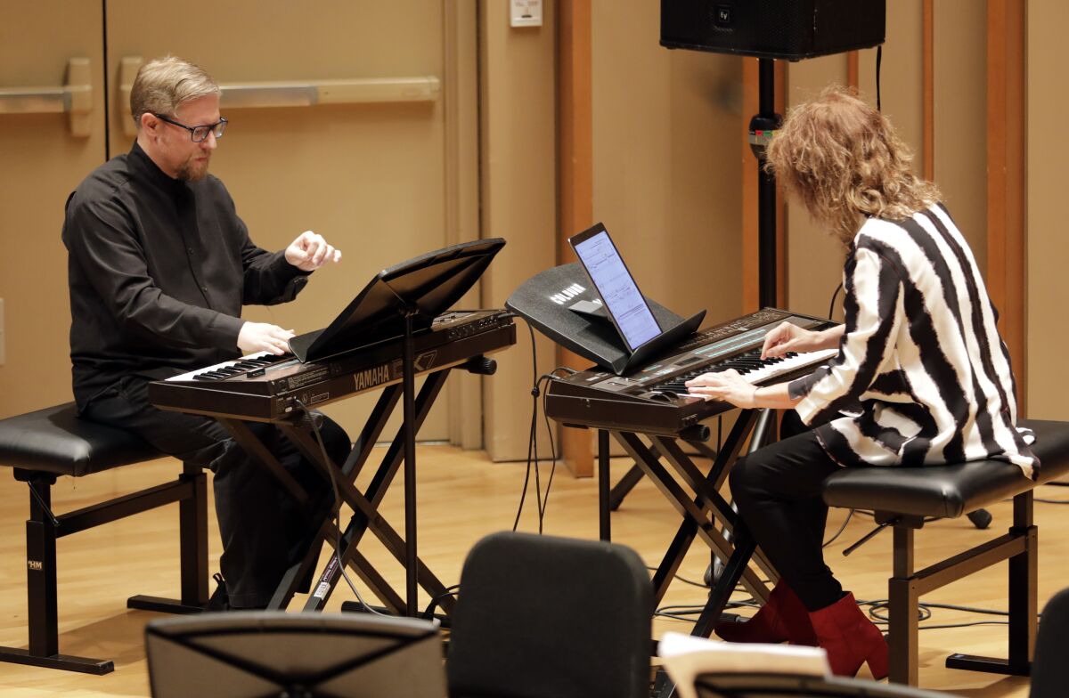 Aron Kallay and Vicki Ray perform “Atlantys” by Tristan Murail during the Piano Spheres concert.
