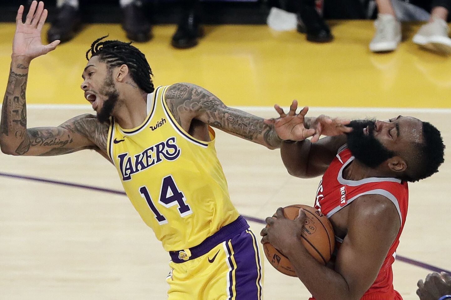 Rockets guard James Harden collides with Lakers forward Brandon Ingram, who was called for a foul on the play with 4 minutes left in the fourth quarter. That led to an exchange of words before Ingram shoved Harden, igniting a brawl.