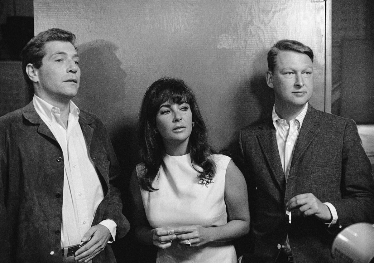 Mike Nichols, right, with Elizabeth Taylor and George Segal, stars of 'Who's Afraid of Virginia Woolf?' in 1965.