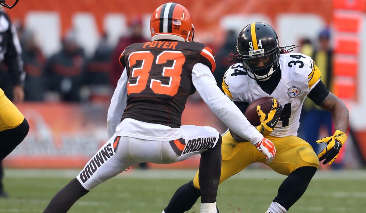 Pittsburgh Steelers running back DeAngelo Williams (34) tries to run past Cleveland Browns cornerback Jordan Poyer (33) during the first half last Sunday.