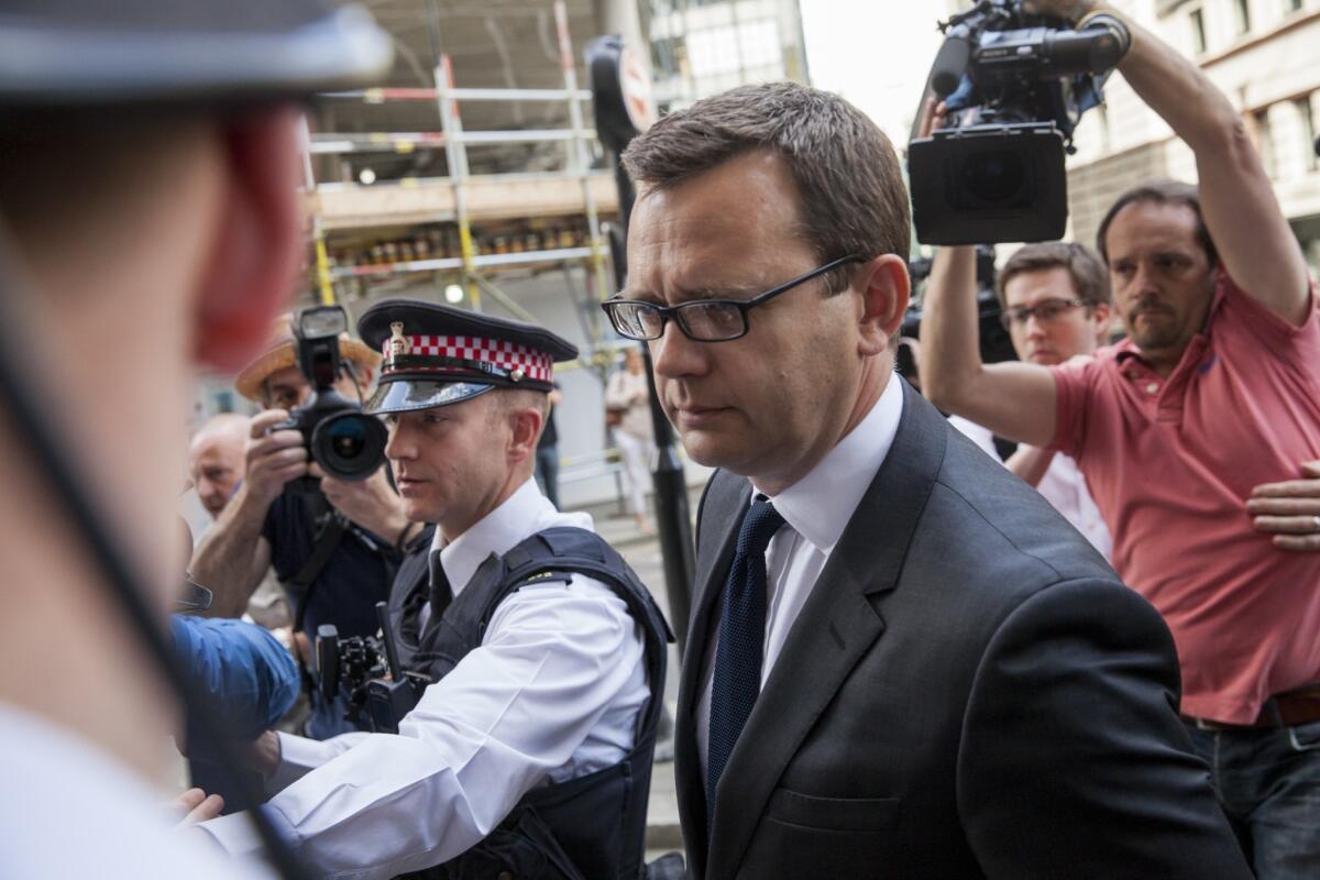 Andy Coulson, a former News of the World editor and senior aide to Prime Minister David Cameron, arrives at court, where he was sentenced to 18 months in jail for offenses related to the illegal hacking of mobile phones.