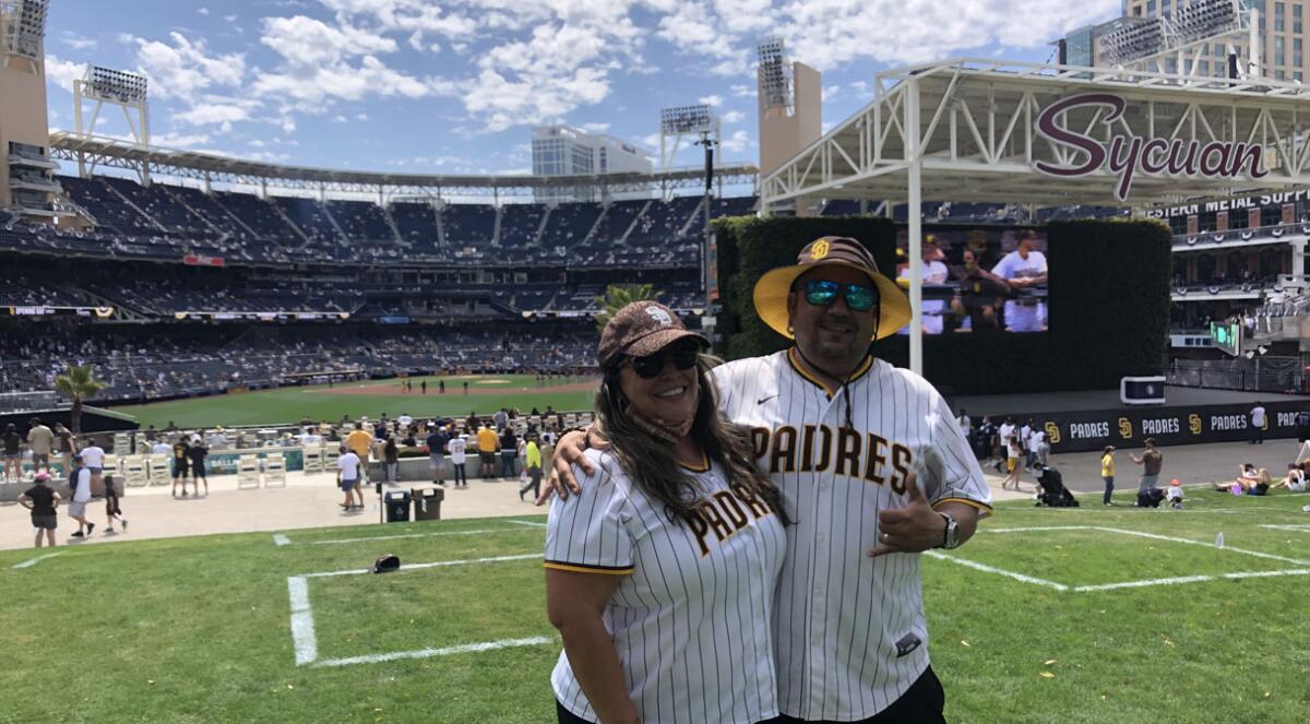 Sergio and Kristina Almada of Chula Vista enjoy opening day from the Park at the Park.