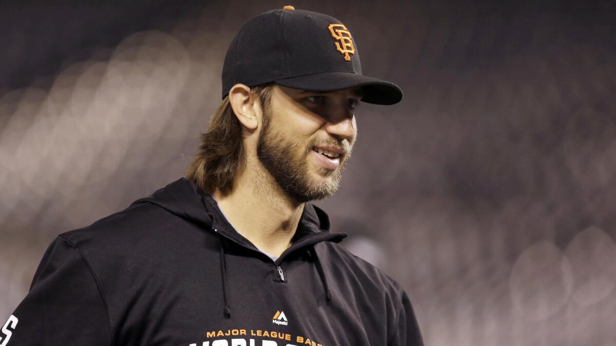 San Francisco Giants starting pitcher Madison Bumgarner smiles while taking part in a team workout session in Kansas City on Oct. 27.