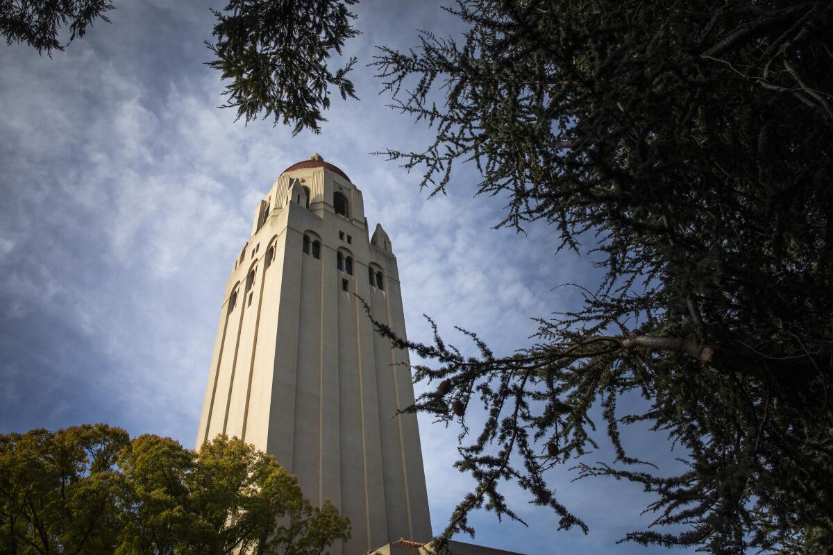 A tower rises against the sky. 