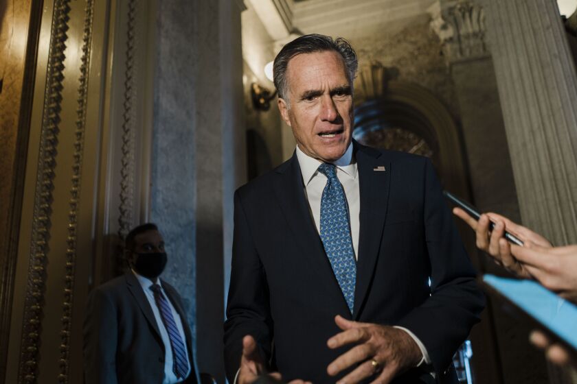 WASHINGTON, DC - FEBRUARY 10: Sen. Mitt Romney (R-UT) speaks with reporters just outside of the Senate Chamber during a vote on Capitol Hill on Thursday, Feb. 10, 2022 in Washington, DC. (Kent Nishimura / Los Angeles Times)