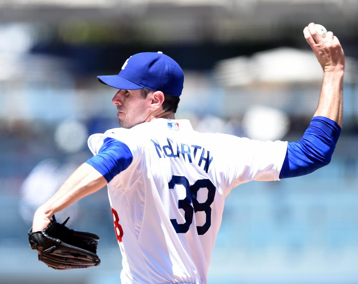 Dodgers pitcher Brandon McCarthy delivers in the second inning against the Rockies. He and two relievers combined for a four-hit shutout.