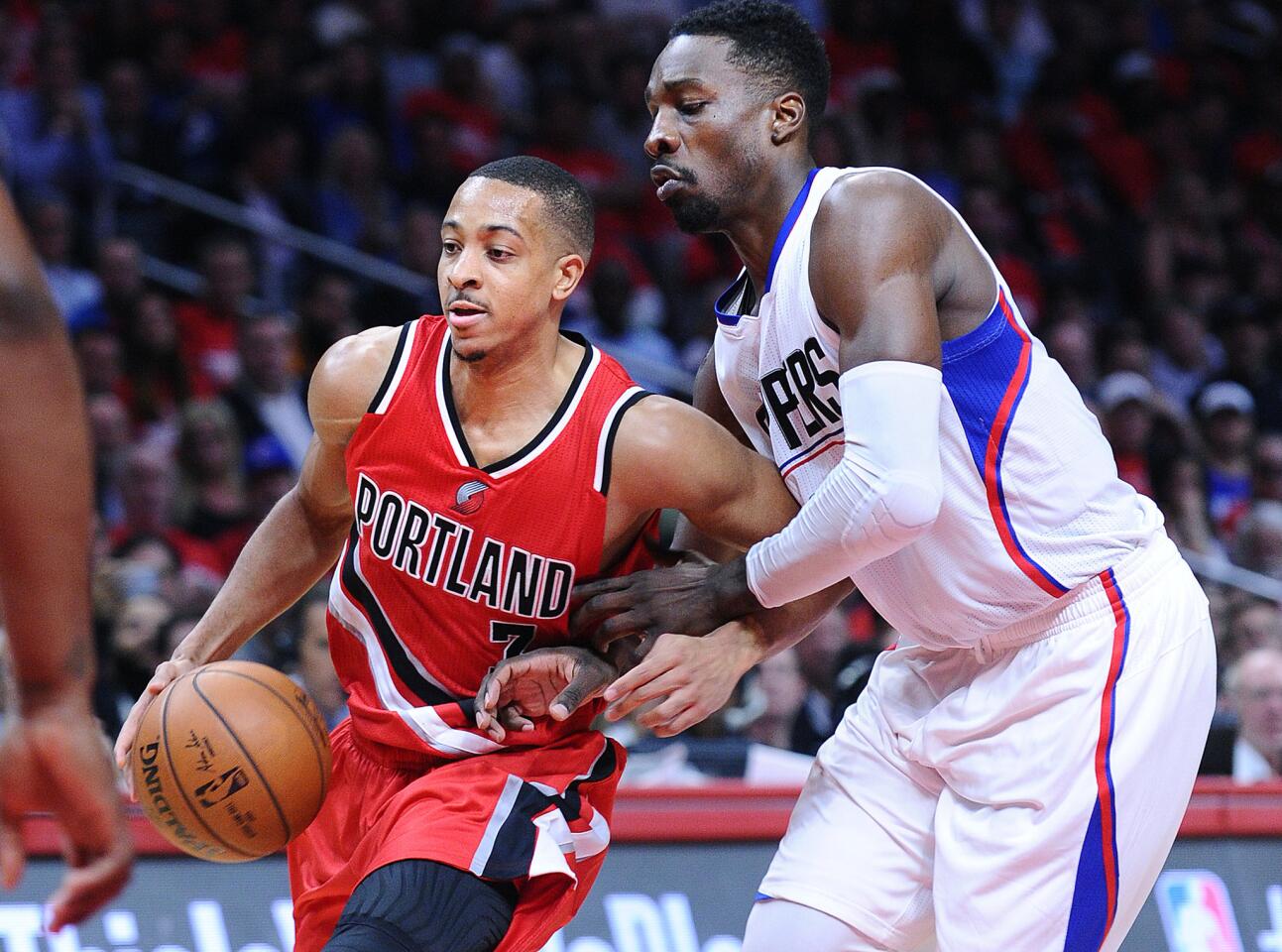 Trail Blazers guard C.J. McCollum tries to drive past Clippers foward Jeff Green during Game 5 of their playoff series last spring.