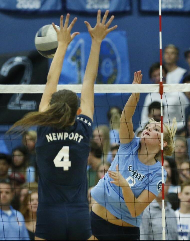 Corona del Mar High's Brooke Cuthbertson (8) is challenged at the net by Newport Harbor's Vivian Donovan (4).