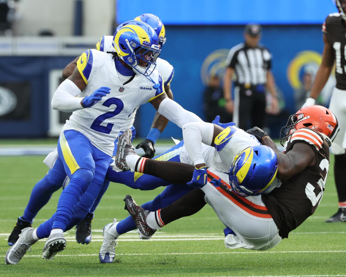 The Rams' Duke Shelley tackles Browns back Jerome Ford.