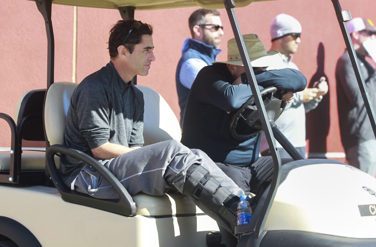 Padres General Manager A.J. Preller wears a protective boot due to stress fracture in his foot.