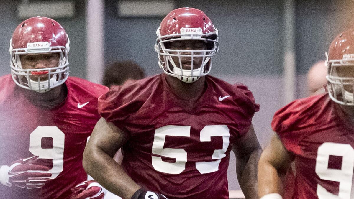 Alabama defensive tackle Jonathan Taylor jogs during a practice session March 13.