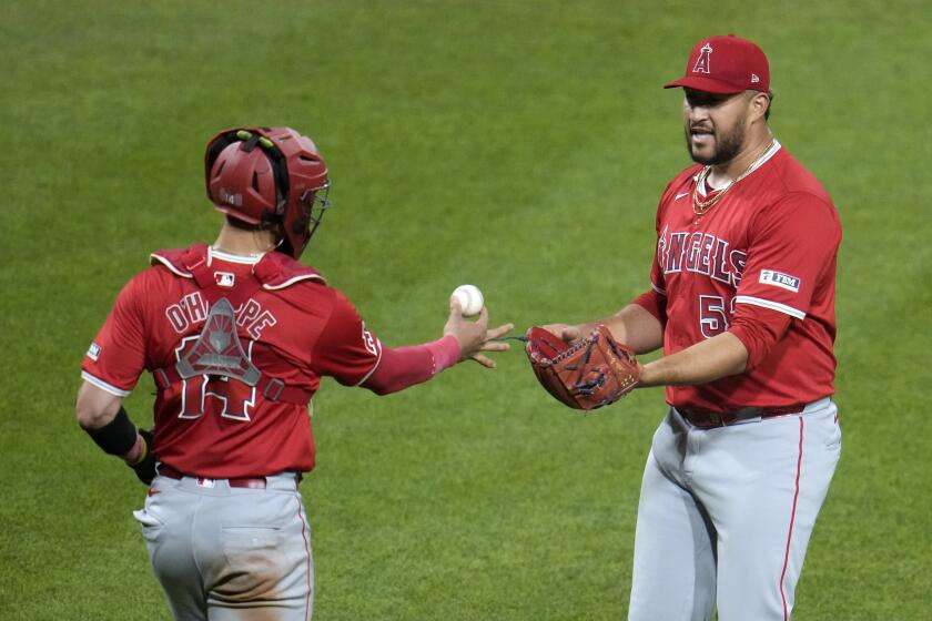 Los Angeles Angels relief pitcher Carlos Estévez, right, celebrates with catcher Logan O'Hoppe after the team's win over the Pittsburgh Pirates in a baseball game in Pittsburgh, Tuesday, May 7, 2024. (AP Photo/Gene J. Puskar)