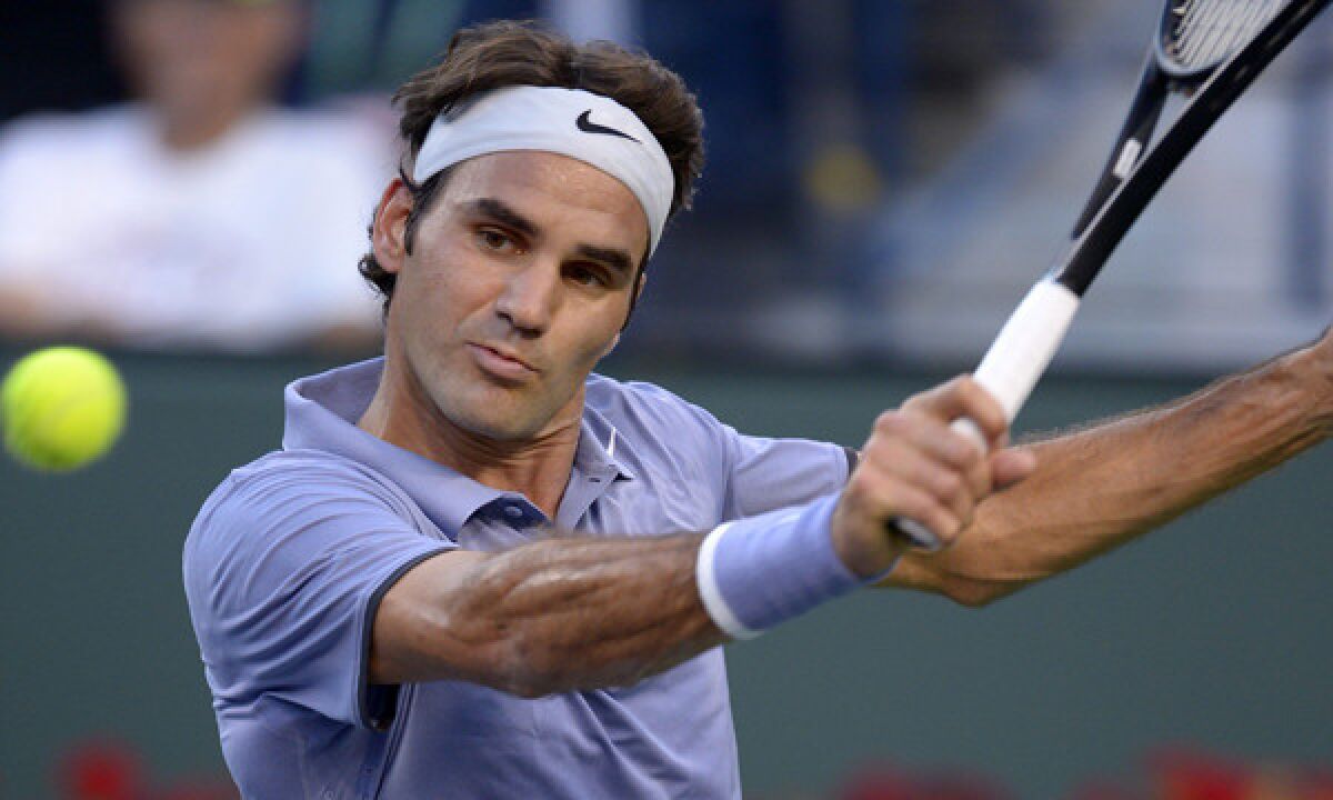 Roger Federer returns a shot during his fourth-round victory over Tommy Haas at the BNP Paribas Open in Indian Wells on Wednesday.