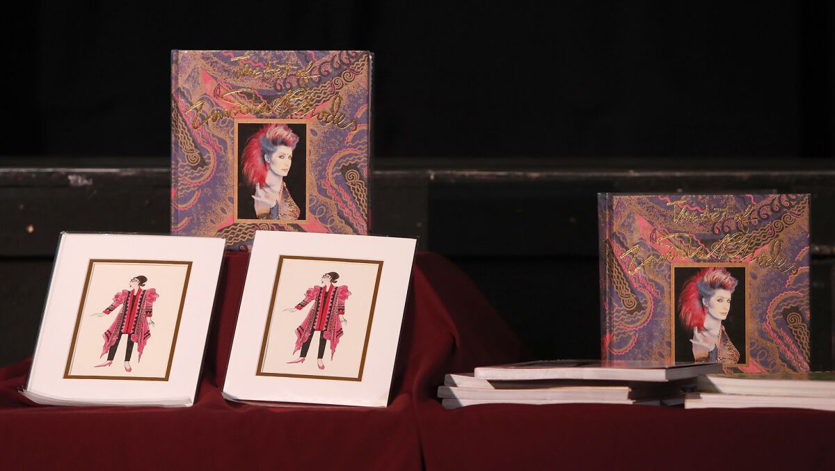 Design prints and albums are on display during British fashion designer Zandra Rhodes' appearance Tuesday at Huntington Beach High School.