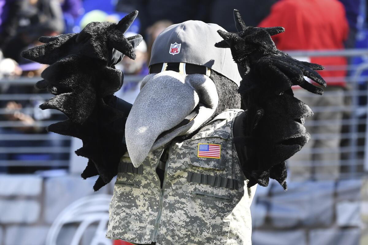 The Baltimore Ravens mascot Poe performs during pre-game warm-ups 