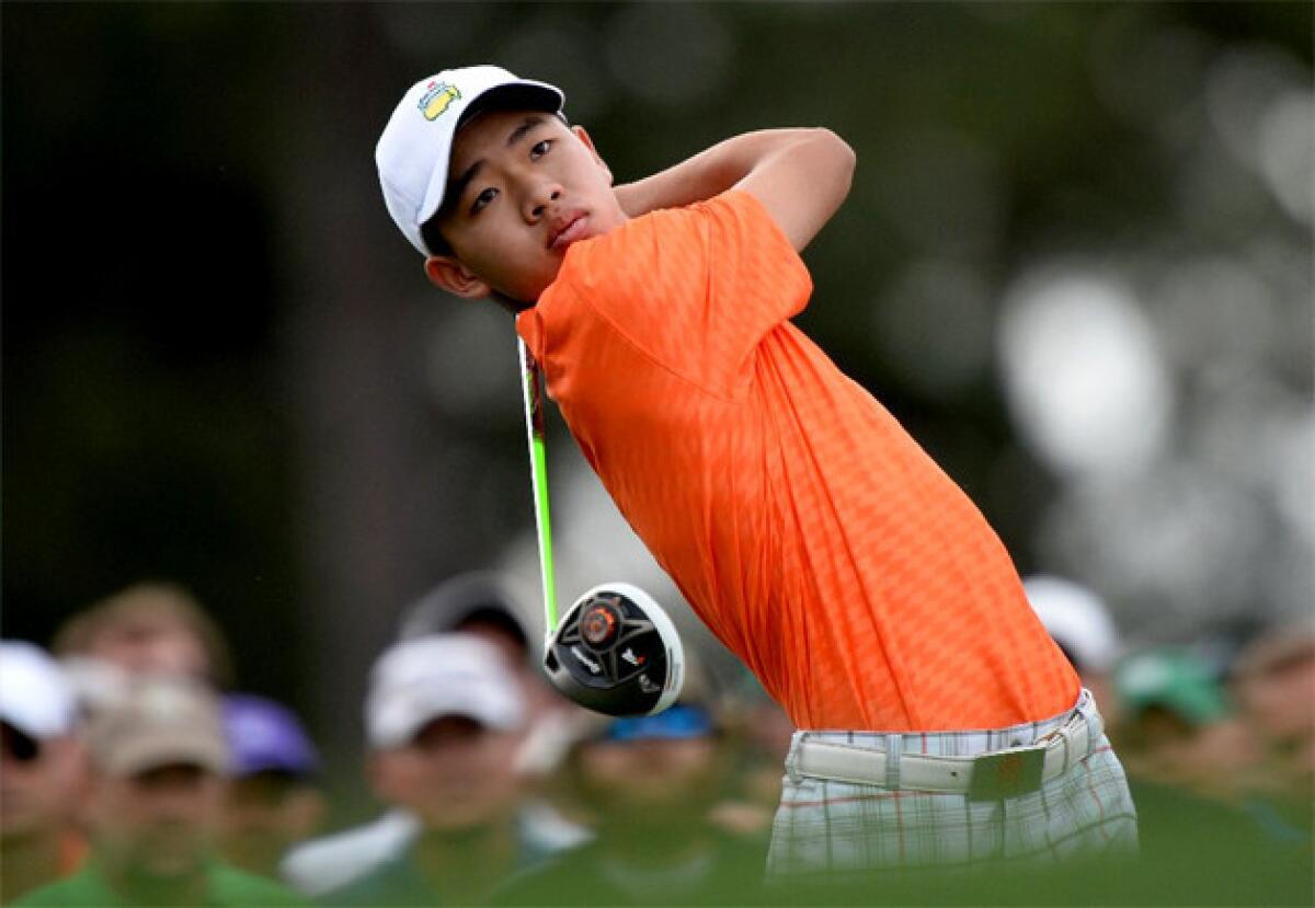 Tianlang Guan plays during the second round of the Masters golf tournament at Augusta National.