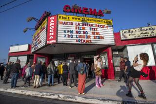 GARDENA, CA-MAY 10, 2023: People gather outside the Gardena Cinema in Gardena, before a screening of the movie, "Liquor Store Dreams," part of the Los Angeles Asian Pacific Film Festival. The community is rallying around the theater as its owner ponders its future. (Mel Melcon / Los Angeles Times)