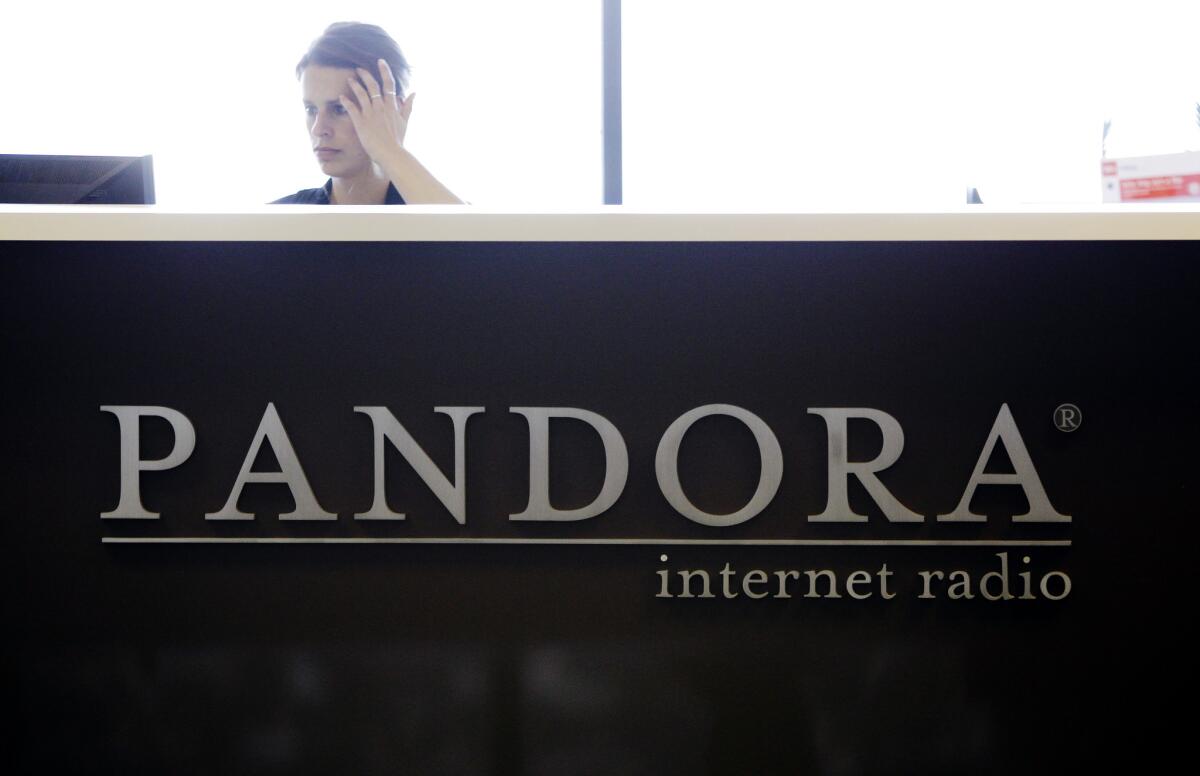 In this June 2011 photo, an employee works in the lobby of Pandora's headquarters in Oakland. This week, a federal judge rejected Pandora's attempt to dismiss a copyright lawsuit brought by Flo & Eddie of 1960s pop-rock artists The Turtles.