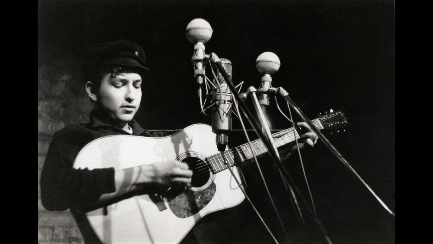 Bob Dylan performs at the Bitter End folk club in Greenwich Village in 1961 in New York City.
