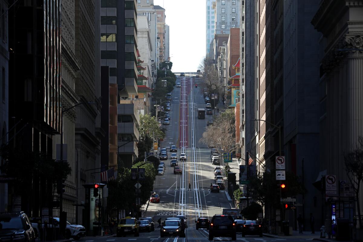 A street drops down a steep hill in San Francisco.