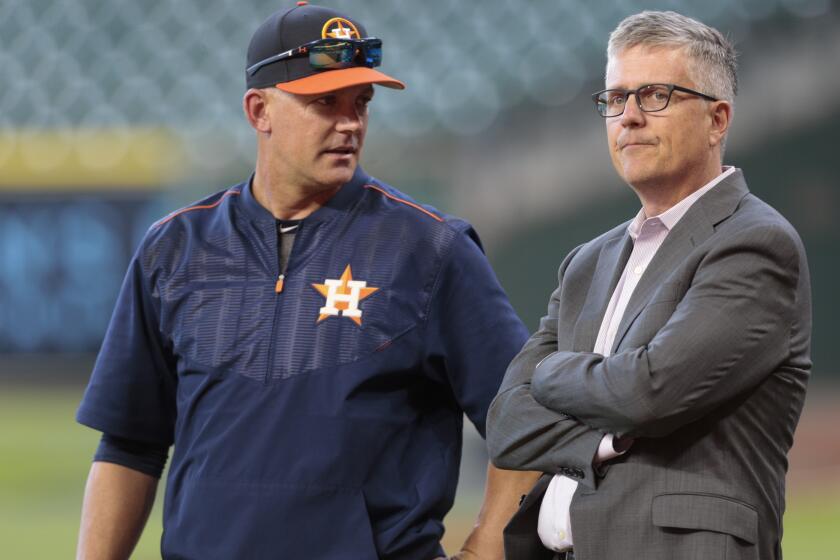 HOUSTON, TX - APRIL 04: Manager A.J. Hinch #14 of the Houston Astros and general manager Jeff Luhnow talk during batting practice at Minute Maid Park on April 4, 2017 in Houston, Texas. (Photo by Bob Levey/Getty Images)