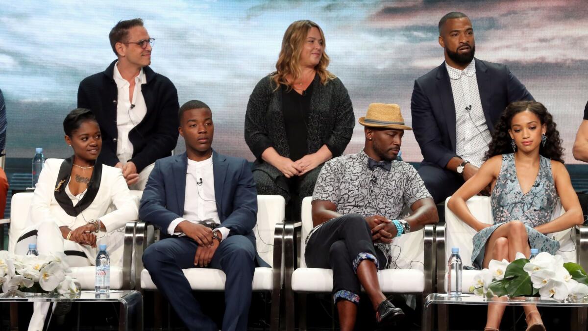 At the TCA press tour for "All American" are, back row from left, Greg Berlanti, April Blair and Spencer Paysinger, and bottom row from left, Bre-Z, Daniel Ezra, Taye Diggs and Samantha Logan.