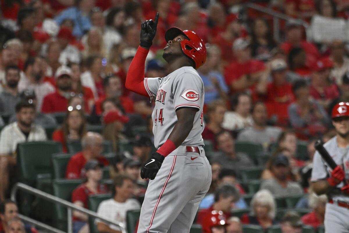Cincinnati Reds' Aristides Aquino gestures after his solo home run during the sixth inning of the team's baseball game against the St. Louis Cardinals on Thursday, Sept. 15, 2022, in St. Louis. (AP Photo/Joe Puetz)
