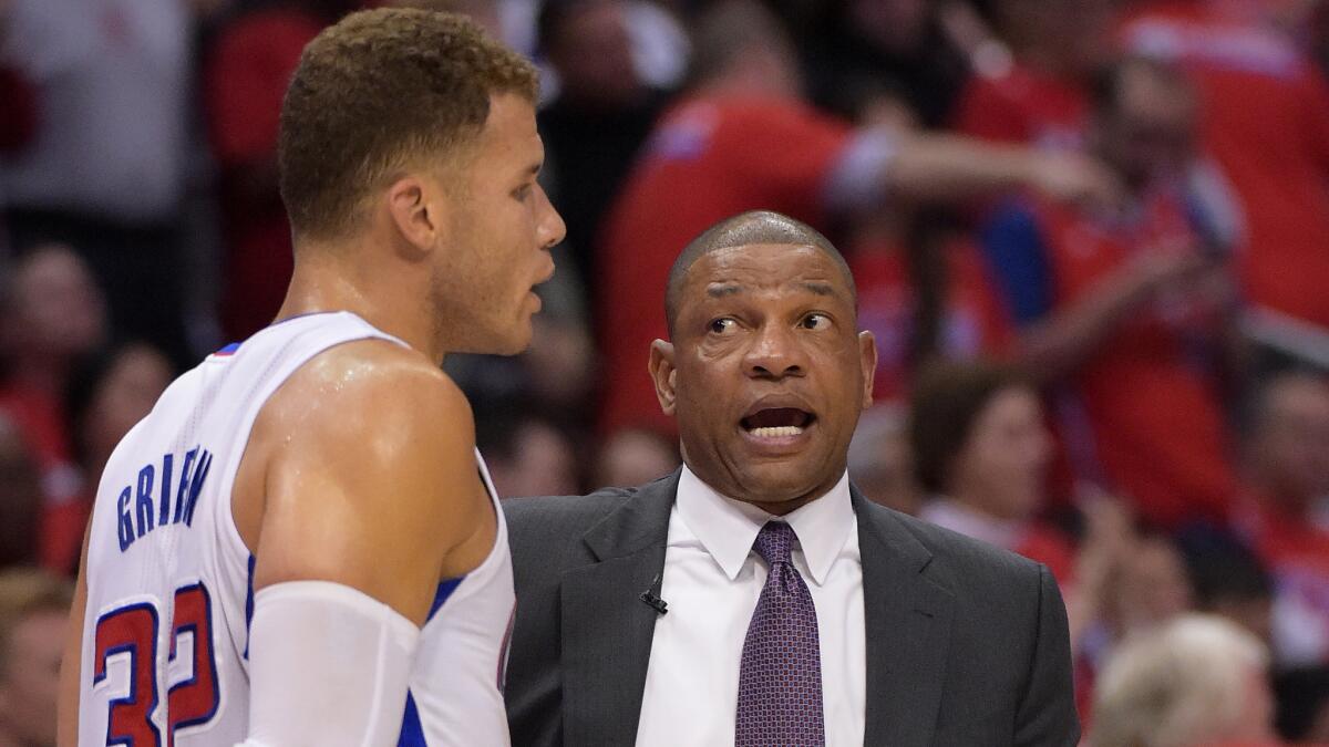 Clippers forward Blake Griffin, left, speaks with Coach Doc Rivers during the team's Game 3 loss to the Oklahoma City Thunder.