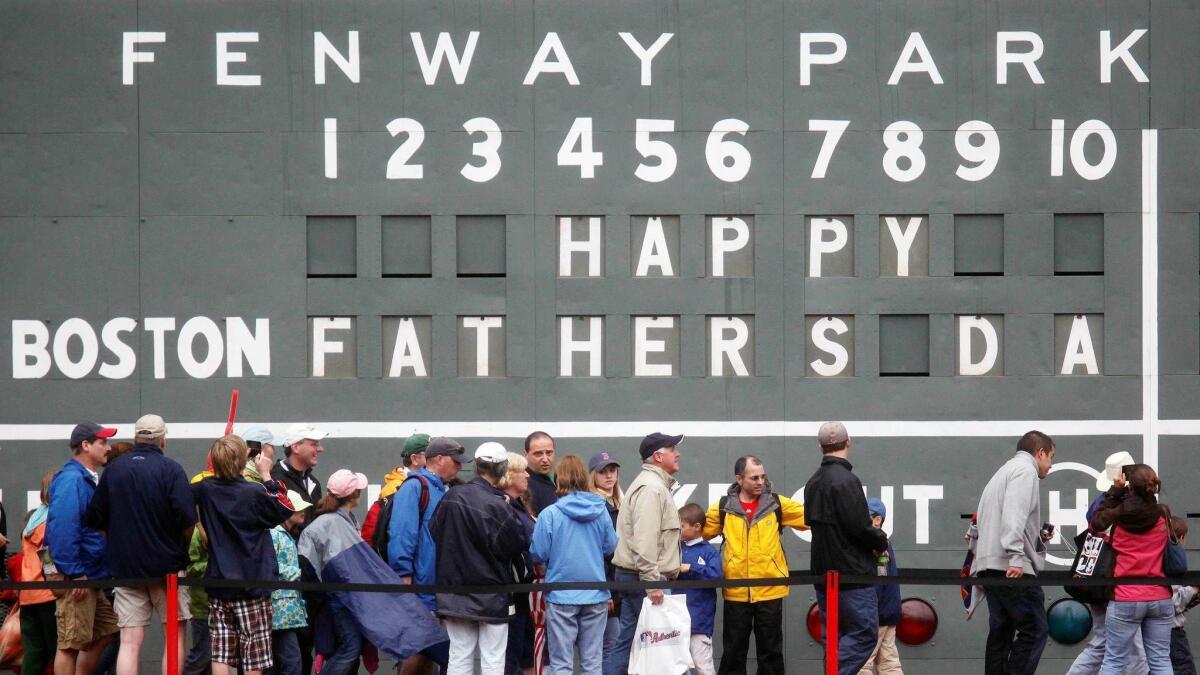 Fans celebrate Father's Day on June 21, 2009, at Fenway Park after a Boston Red Sox game against the Atlanta Braves.