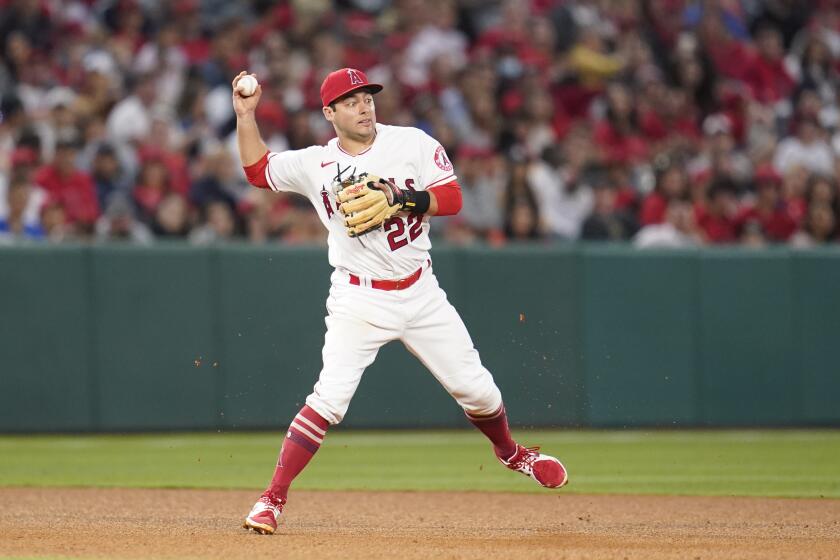 Los Angeles Angels shortstop David Fletcher (22) throws to second during a baseball game against the Washington Nationals in Anaheim, Calif., Friday, May 6, 2022. (AP Photo/Ashley Landis)