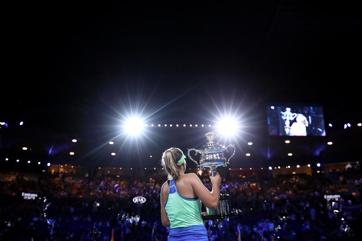 American Sofia Kenin of the United States poses with the Daphne Akhurst Memorial Cup after winning her first career Grand Slam title at the Australian Open.