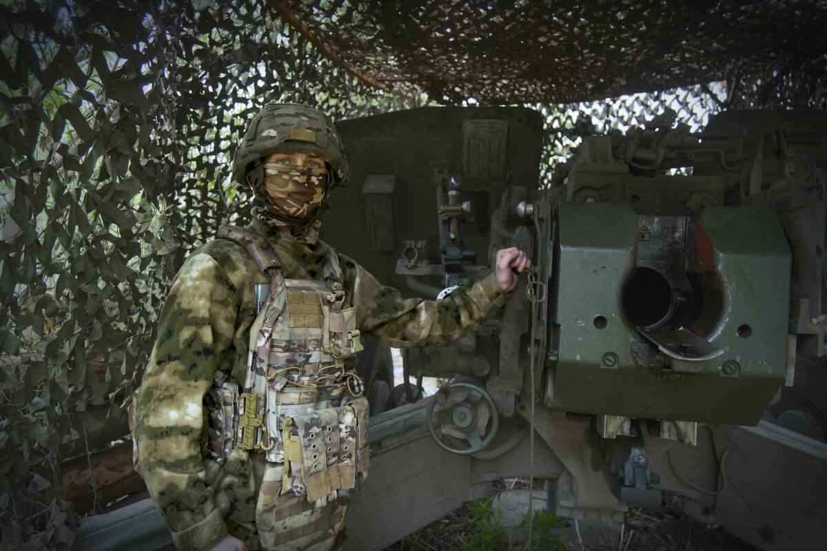 A Russian soldier in an undisclosed location in Ukraine poses for a photo.