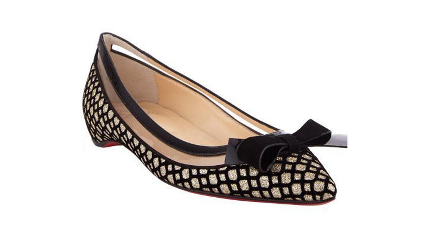 Christian Louboutin's Suspenodo ballerina flats intermix black velvet with pale-gold glitter in a choice crisscross-pattern. Black leather trim with a black suede patent leather bow sits atop the pointed toe. Signature red leather sole. $645. Available at at net-a-porter.com.