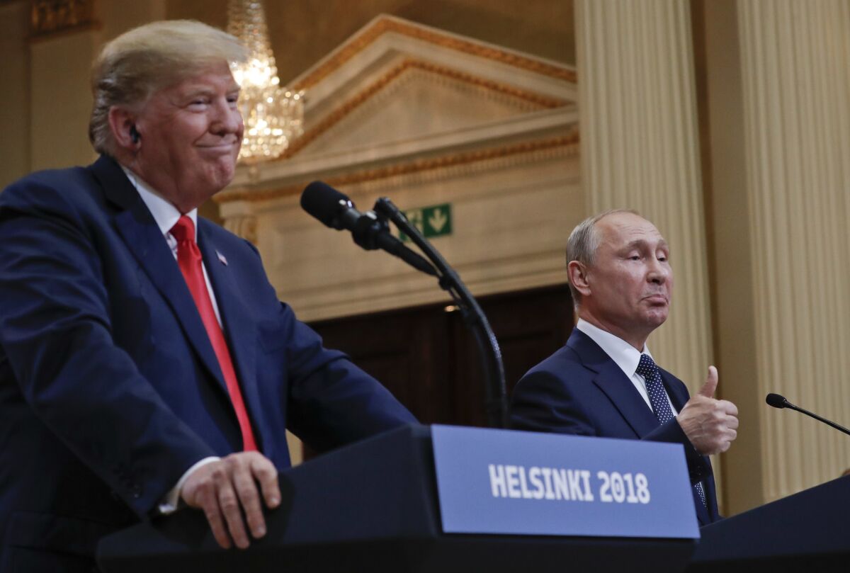 Russian President Vladimir Putin, right, with President Trump, left, during their joint news conference.
