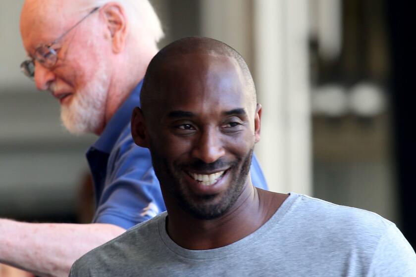 HOLLYWOOD, CALIF. - AUG. 31, 2017. Lakers great Kobe Bryant rehearses with the L.A. Philharmonic on Thursday, Aug. 31, 2017, in preparation for weekend perfomances at the Hollywood Bowl. Bryant was set to narrate "Dear Basketball." a letter that he wrote in contemplation of retirement from the game, and was scheduled to be accompanied by the philharmonic under conductor and composer John Williams, background. (Luis Sinco/Los Angeles Times)