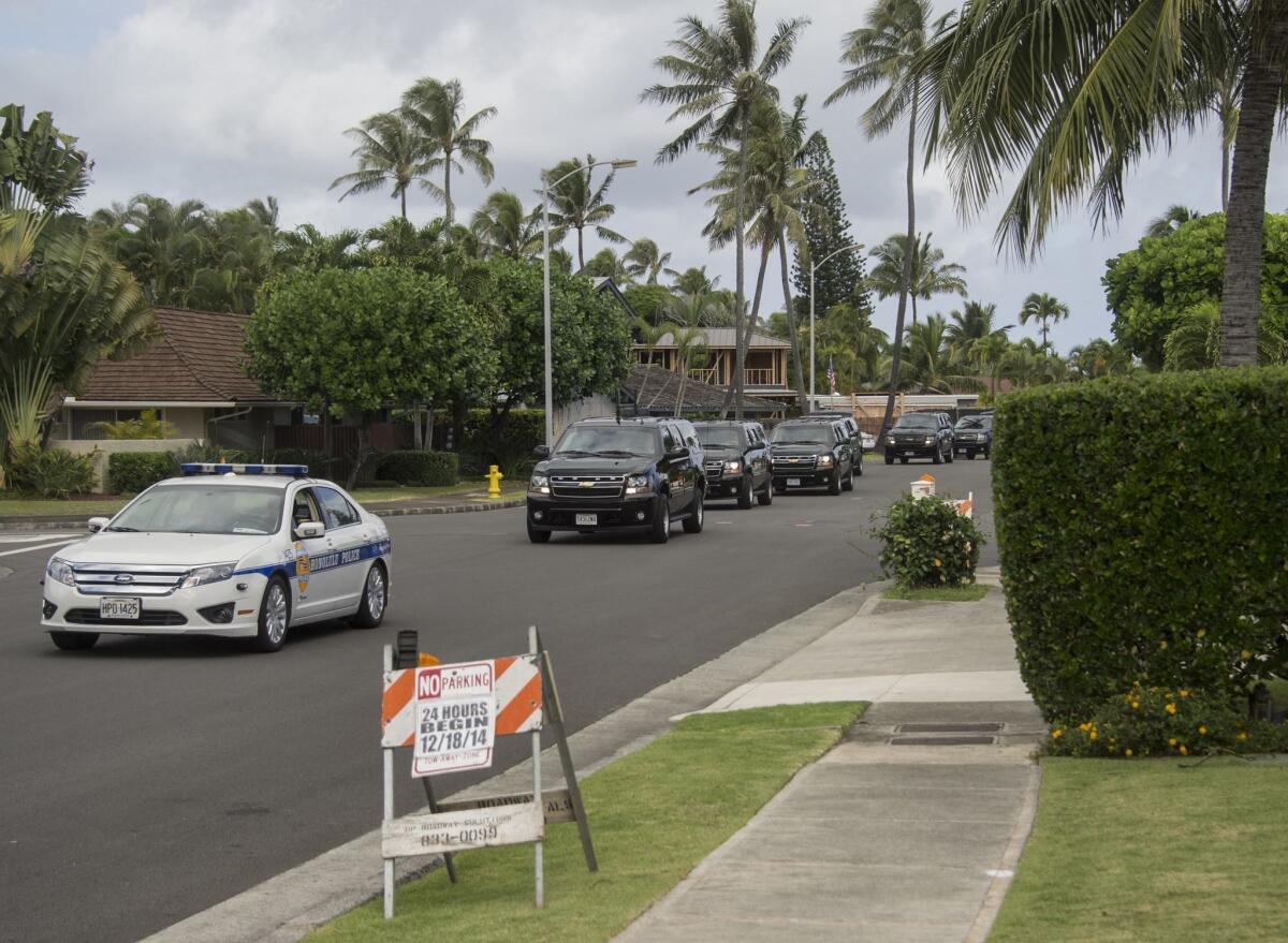 President Obama's motorcade leaves his vacation residence in Kailua as he goes to play golf at nearby Marine Corps Base Hawaii.