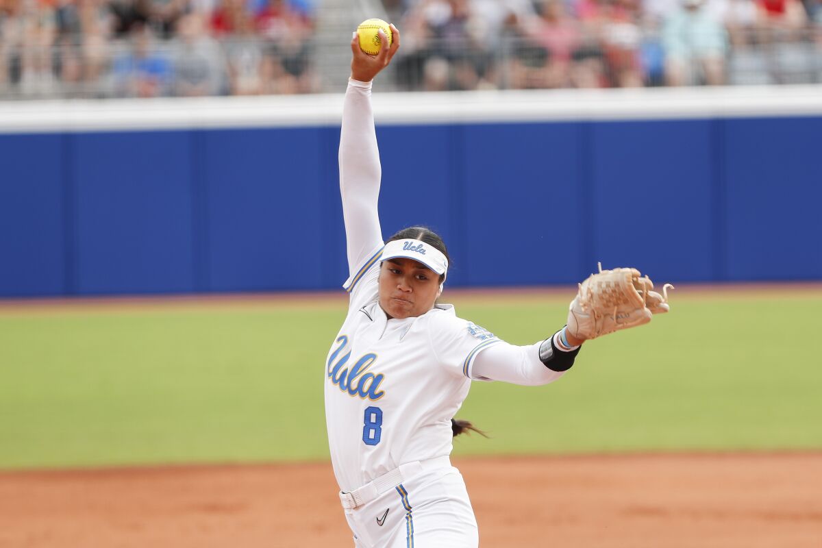 UCLA starting pitcher Megan Faraimo delivers during the first inning against Texas.