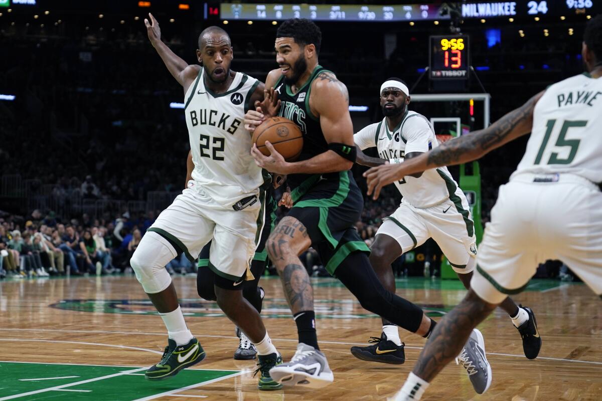 Tatum shakes off illness, helps Celtics slow Giannis and beat fellow East power Bucks 119-116 - The San Diego Union-Tribune