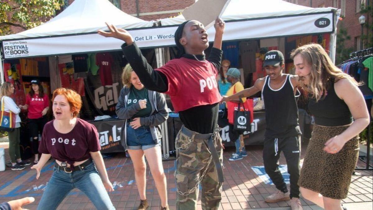 Get Lit poets C.E Oldham, from left, Tyris Winter, Khamal Iwuanyanwu and Mila Cuda perform for passersby at the recent Los Angeles Times Festival of Books.