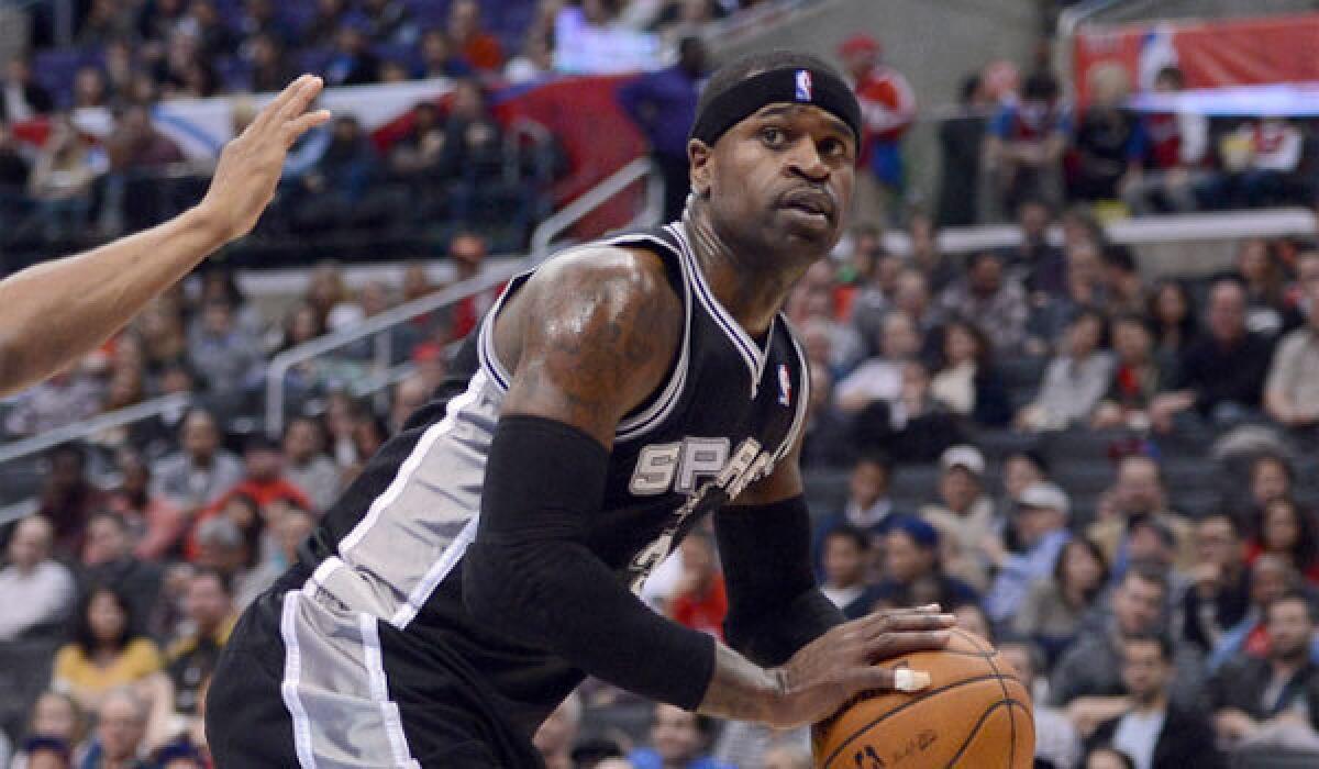 Stephen Jackson, then a member of the San Antonio Spurs, plays against his current team, the Clippers, at Staples Center in February.