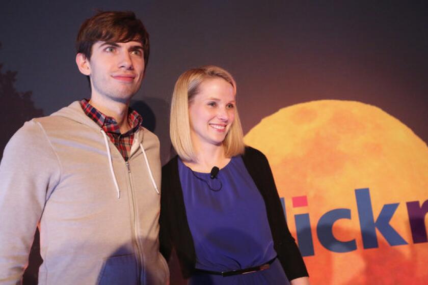 Tumblr founder David Karp poses after a news conference with Yahoo CEO Marissa Mayer.