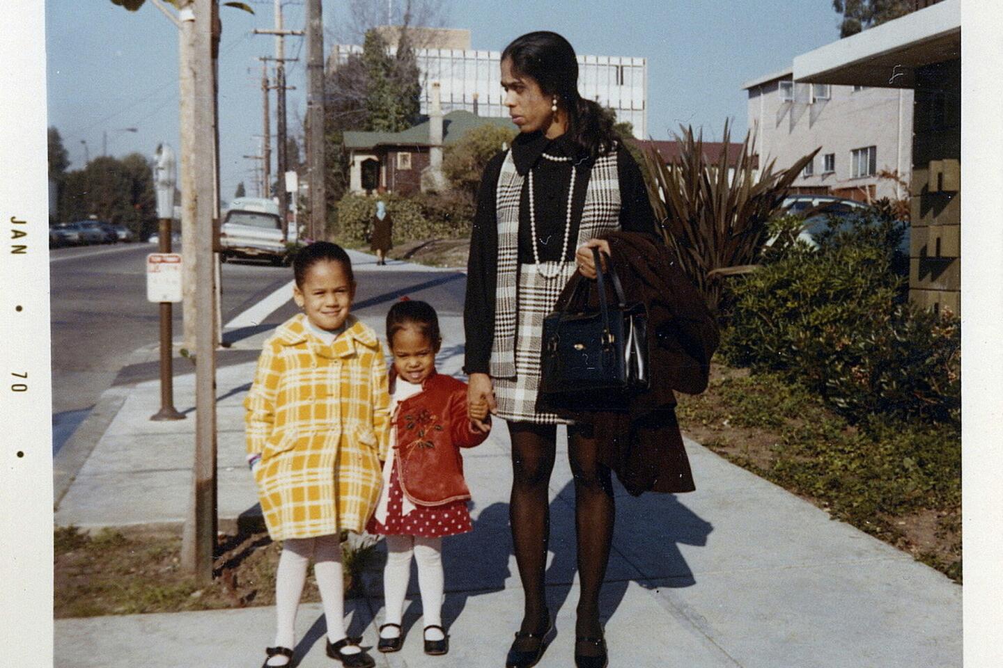 Kamala Harris, left, sister Maya and mom Shyamala outside their Berkeley apartment in 1970.